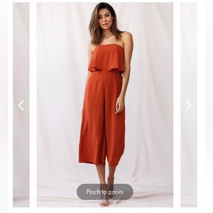 Strapless jumpsuit. Burnt orange, size small, wide leg with back zipper.
